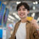 Asian young man passenger holding credit card in airport terminal. Attractive male tourist feeling happy and excited for going travel abroad by airplane and doing shopping in duty free area of airport
